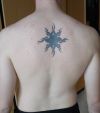 tribal sun back tattoo pic